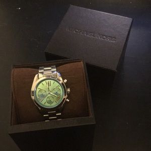 Micheal Kors watch. Silver with a blue/green face